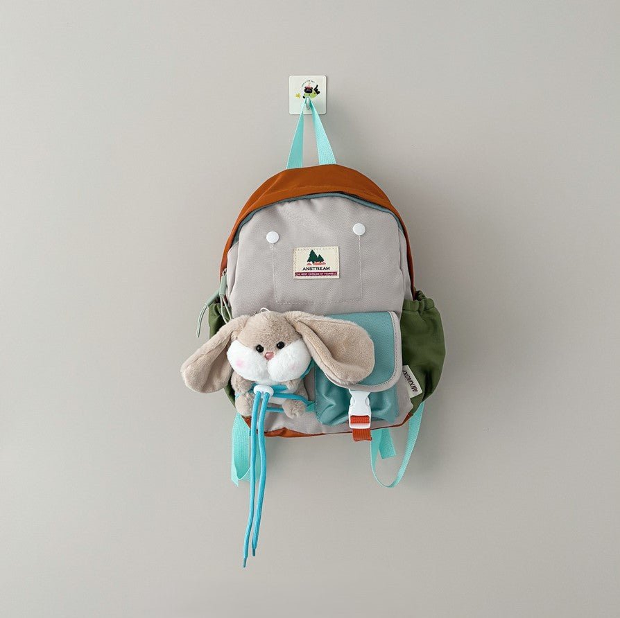 kids backpack with rabbit plush toy, lightweight durable design, fits snacks, bottle, and toys for kindergarten use.
