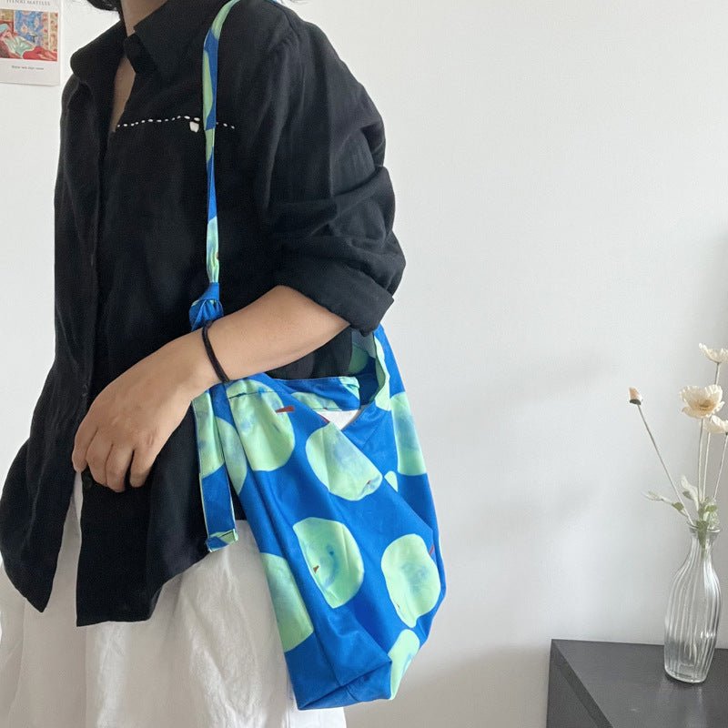 Apple pattern cotton canvas tote bag with spacious design. Durable, lightweight, fits iPad, clothes, shoes for daily use.