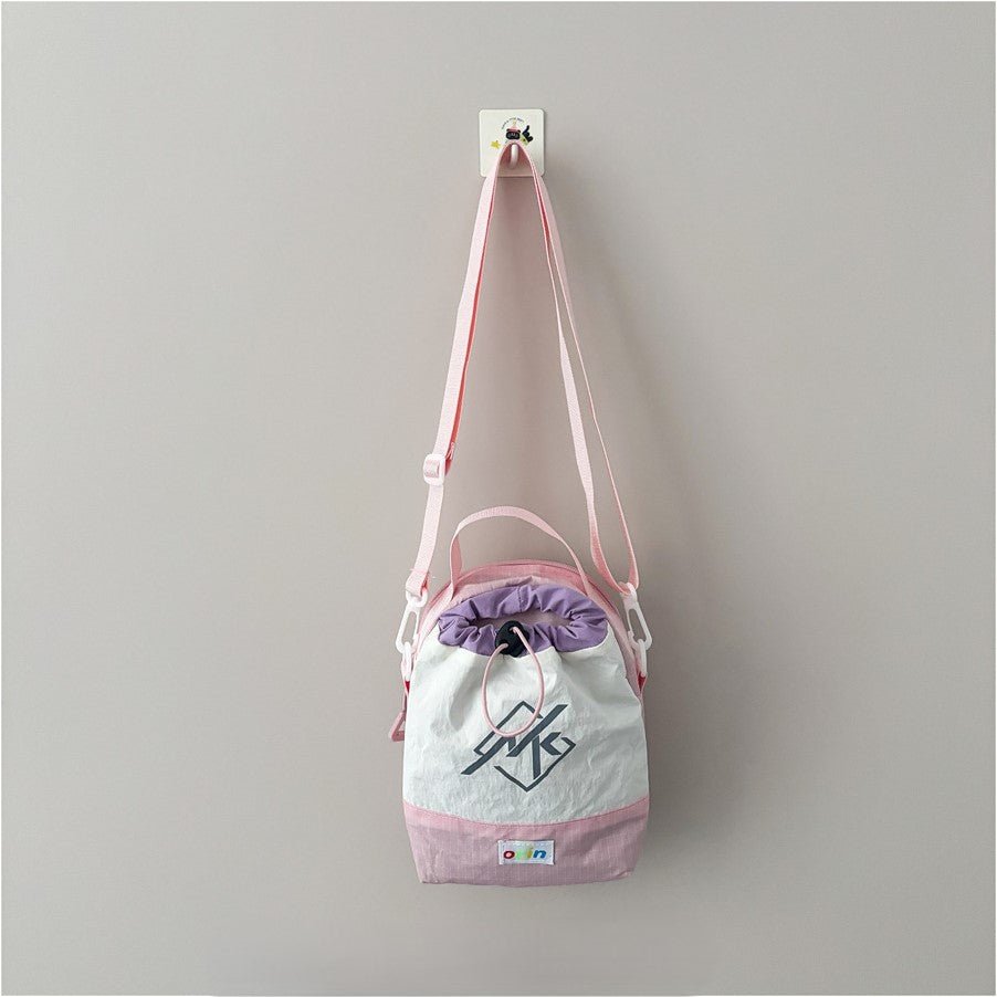 Kids mini shoulder bag, 100g ultra-light, water-resistant, nylon blend, adjustable strap, fits snacks and small essentials.