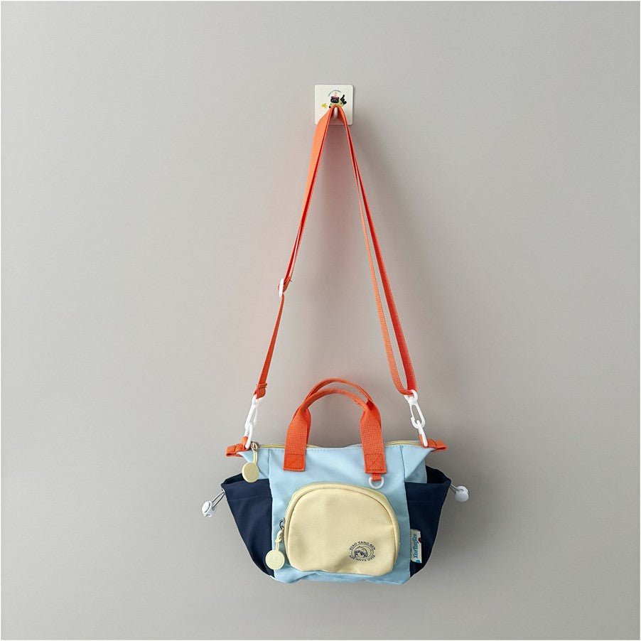Kids mini crossbody bag, 170g lightweight, nylon blend, multi-carry, fits snacks, toys, small essentials.