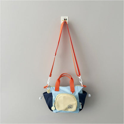 Kids mini crossbody bag, 170g lightweight, nylon blend, multi-carry, fits snacks, toys, small essentials.