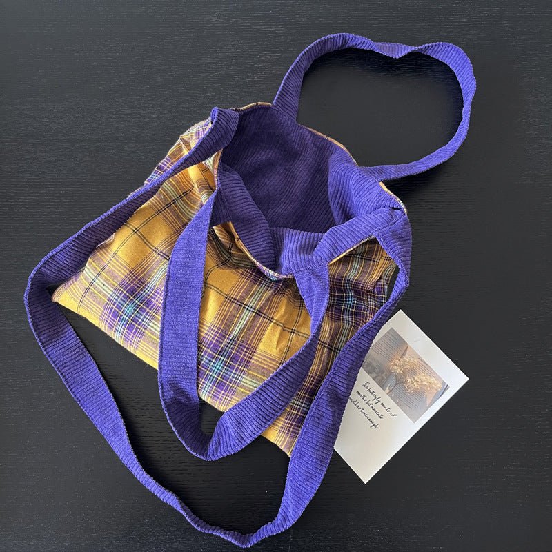 Purple corduroy tote bag with soft textured fabric, spacious interior, durable stitching, for daily use, commuting & travel.